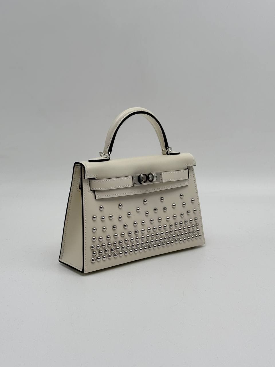 Hermès Kelly Mini II Clouté Cream Box calf with palladium studs, side view — 2