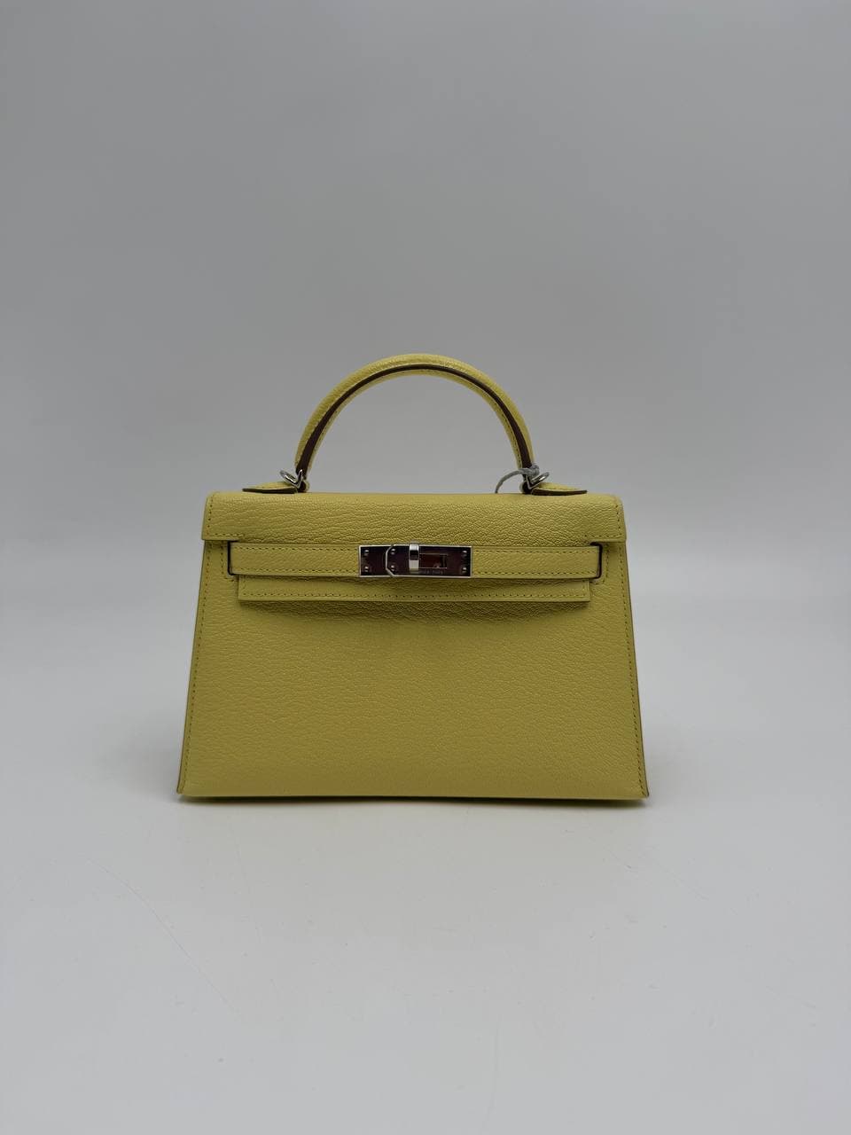 Hermès Kelly Mini II Limoncello Chèvre front with shoulder strap