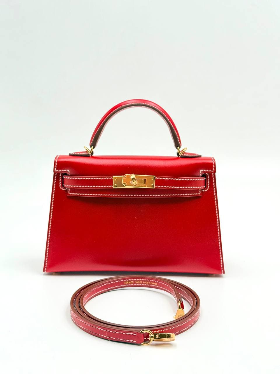 Hermès Kelly Mini II Rouge Piment Box calf front with gold hardware and strap