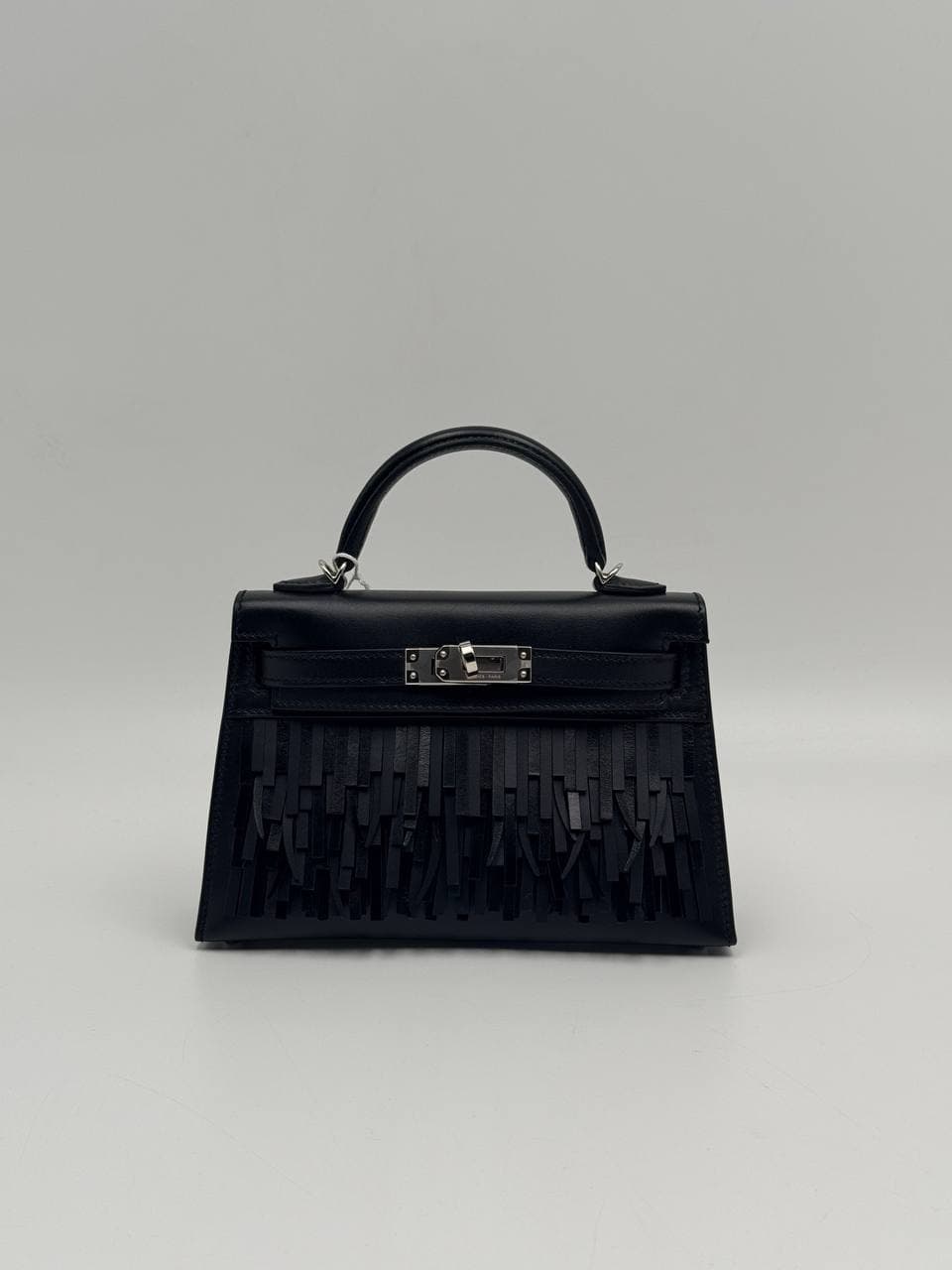 Hermès Kelly Mini II Pampilles Noir Tadelakt front with leather fringe