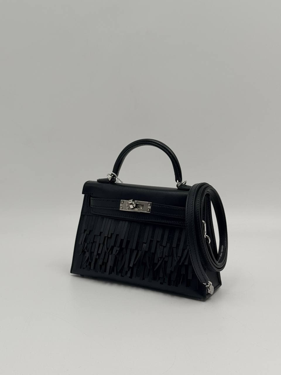 Hermès Kelly Mini II Pampilles Noir Tadelakt front with leather fringe — 3