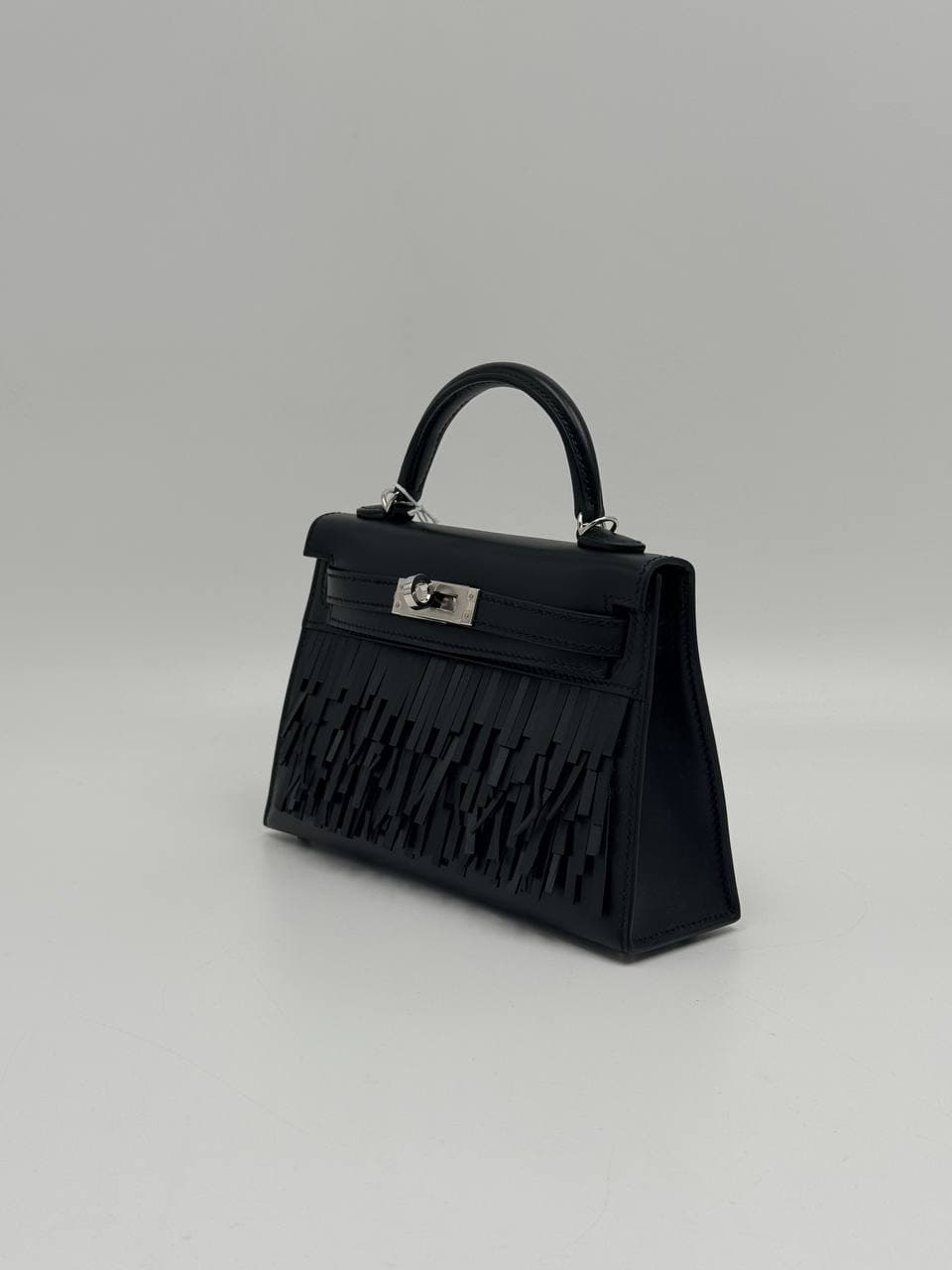 Hermès Kelly Mini II Pampilles Noir Tadelakt front with leather fringe — 2